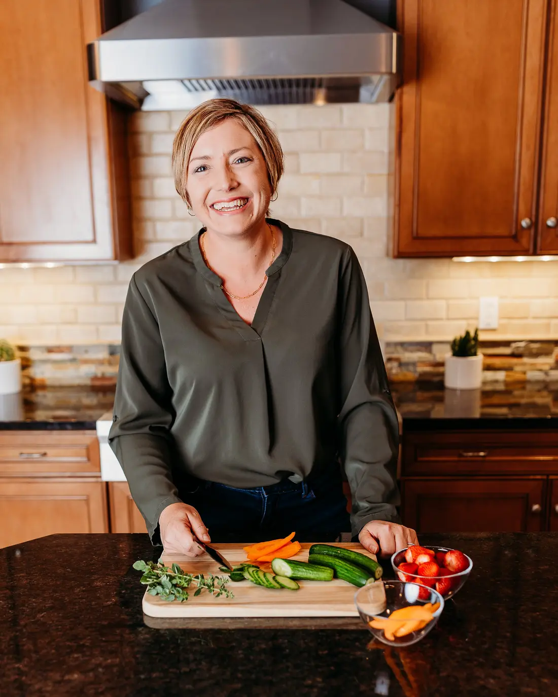 Stacy Olinger preparing food in her home kitchen